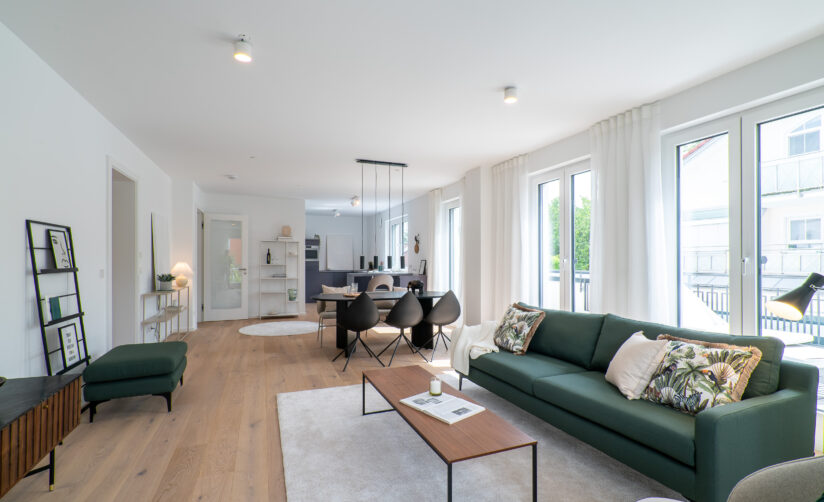 Wohnzimmer Dachgeschoss Neubau Mehrfamilienhaus von DOMINO Bau in Bogenhausen-Denning